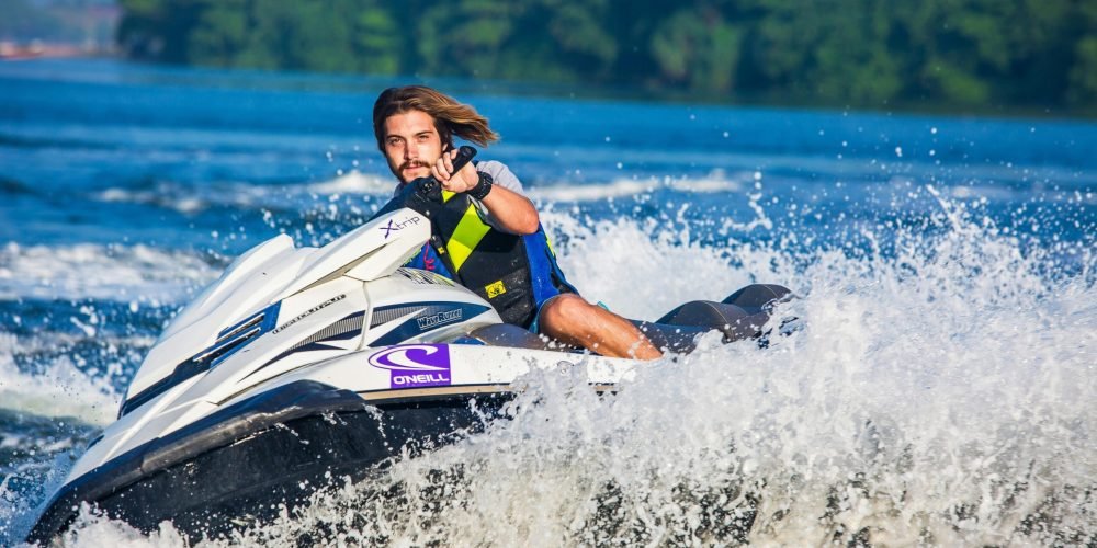 boy riding a jet ski