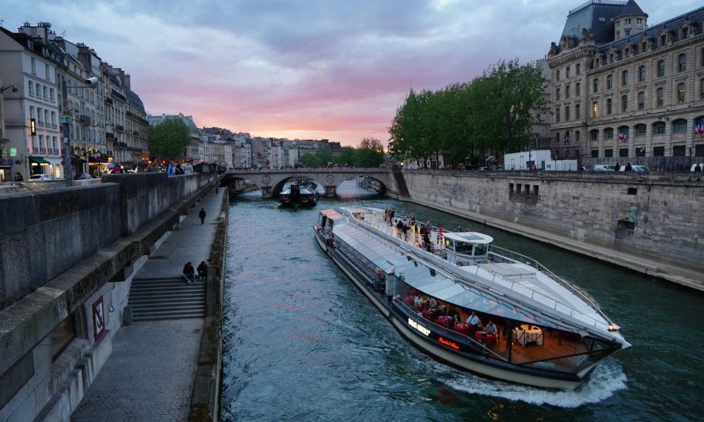 Evening cruise on the Seine River with a sunset backdrop